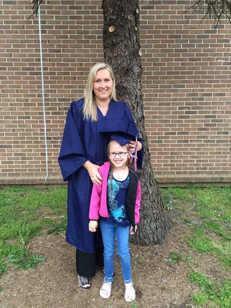 Mom in her graduation gown at her GED ceremony